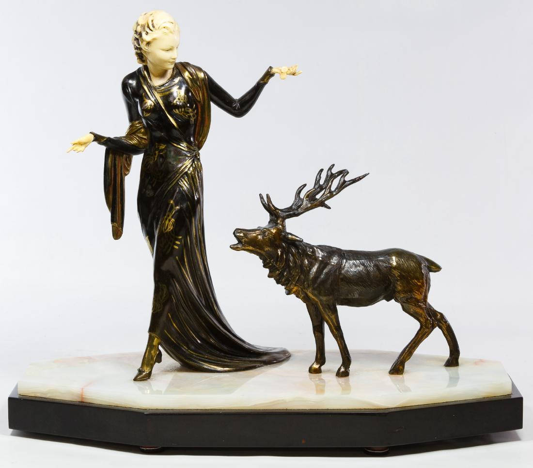 Alabaster and Spelter 'Lady and the Elk' Statue: Alabaster and Spelter 'Lady and the Elk' Statue 20th Century, depicting a lady walking with an elk Height: 17.50 inches, Width: 21.00 inches, Depth: 9.00 inches Category: Decorative Arts > Statues Shi