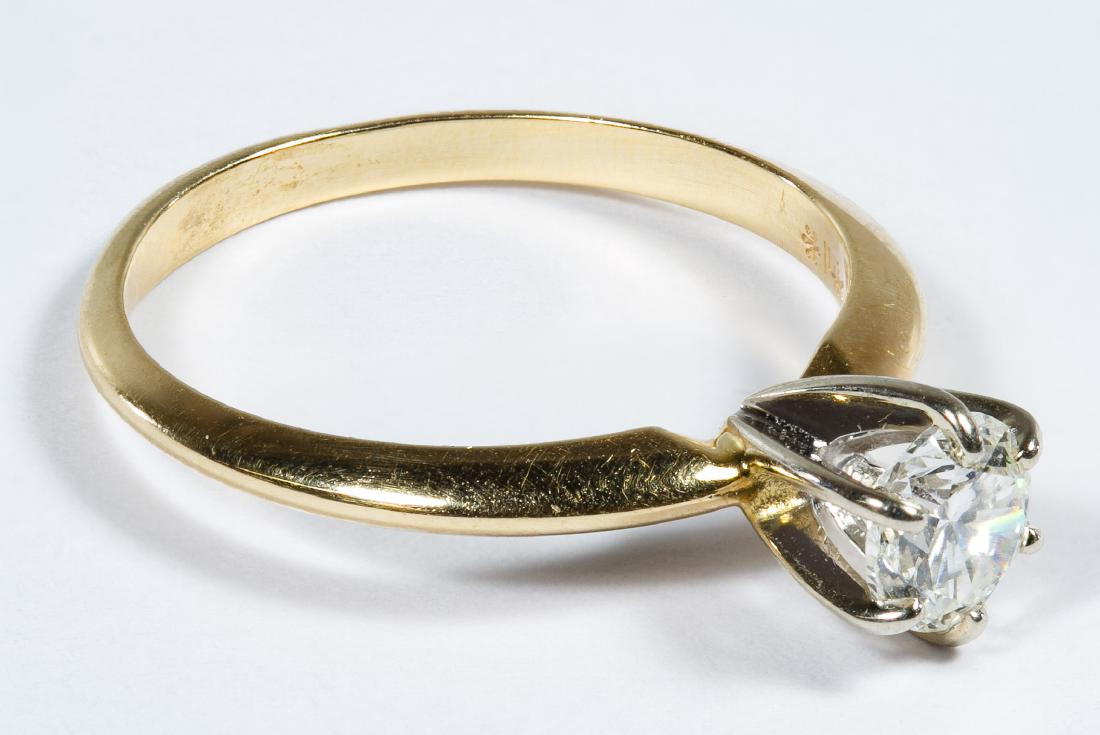 14k Gold and Diamond Ring: 14k Gold and Diamond Ring Having a solitaire round cut diamond weighing approximately 0.50Ct, clarity SI-1, color H-I; marked '14k' inside band Size: 6.25 Weight: 1.41 dwts. (total weight) Category: F