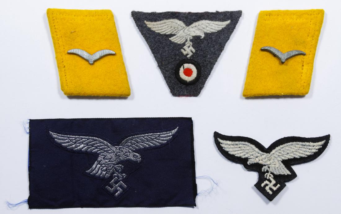 World War II German Collar Tabs and Luftwaffe Eagles: World War II German Collar Tabs and Luftwaffe Eagles Five items including two collar tabs and three luftwaffe eagles Width: 4.00 inches (widest) Category: Military & Weapons > World War II Shipping St