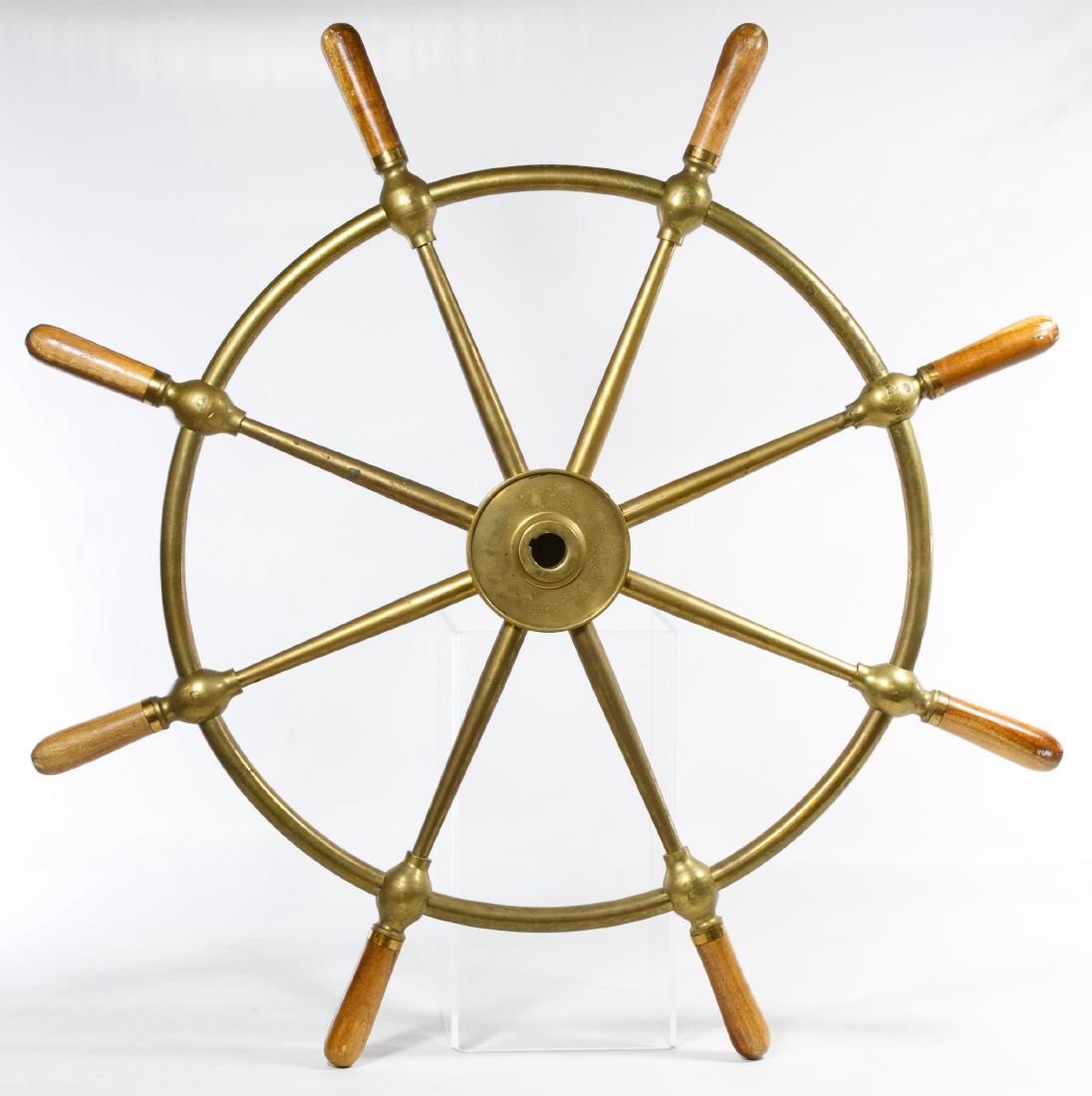 Brass and Wood Ship Wheel by Brown Bros. & Co.: Brass and Wood Ship Wheel by Brown Bros. & Co. Eight wood handles, also marked 'Rosebank Ironworks Edinburgh' in the center Diameter: 31.00 inches Category: Collectibles > Transportation Shipping Stat