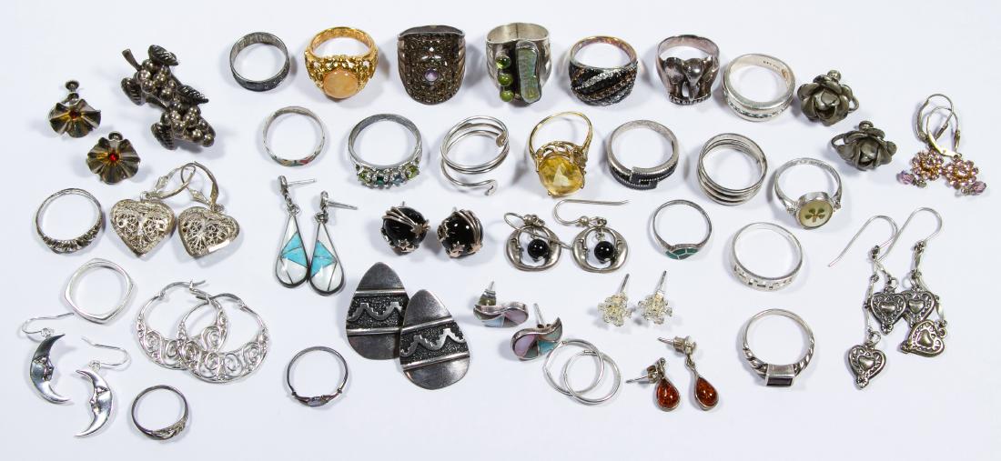 Sterling Silver Ring and Earring Assortment: Sterling Silver Ring and Earring Assortment Including twenty-one rings, thirteen pairs of pierced earrings and three pair of screw-back earrings; all marked '925' or 'sterling', some adorned with glas