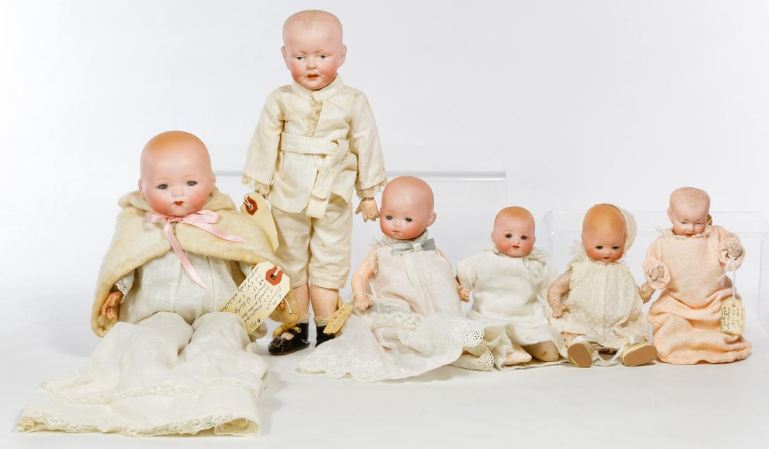 German Bisque Baby and Toddler Doll Assortment: German Bisque Baby and Toddler Doll Assortment Six dolls including a painted dome head #159 with intaglio eyes on a composition straight limb body, a dome head painted eye baby, an Armand Marseille #3
