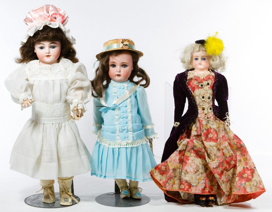 German Bisque Doll Assortment: German Bisque Doll Assortment Three dolls including a K*R Simon & Halbig #43 with composition body, an unmarked turned shoulder head on leather body with bisque lower arms and a Simon & Halbig #1260 '
