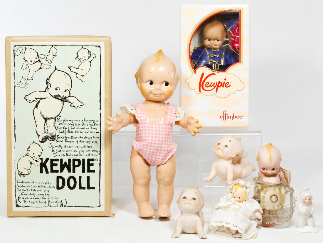Kewpie and Japanese Bisque Assortment: Kewpie and Japanese Bisque Assortment Eight items including a 2004 Danbury Mint porcelain Kewpie, a 2001 Effanbee Nutcracker soldier Kewpie, an unmarked composition Scootles doll, a Rosie O'Neill mark