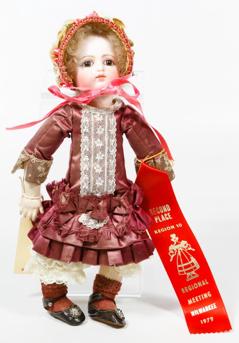 Rabery & Delphieu French Bisque Bebe Doll: Rabery & Delphieu French Bisque Bebe Doll Having a bisque socket head marked 'R 5/0 D' with stationary brown glass eyes, original caracul wig, composition ball jointed body, antique dress and French s