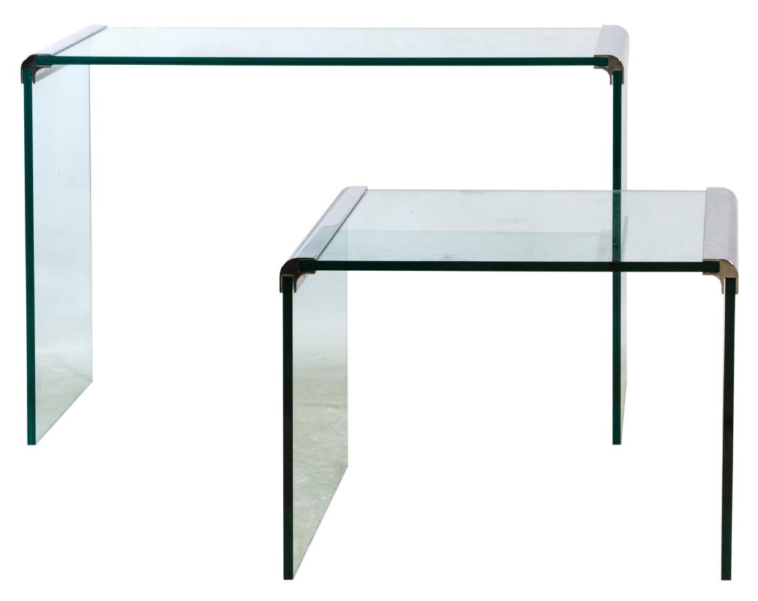 MCM Waterfall Style Glass and Chrome Tables (attributed: MCM Waterfall Style Glass and Chrome Tables (attributed to) Pace Collection Two similar tables having thick glass tops and sides and curved chrome end connectors Height: 33.50 inches, Width: 50.00 inc