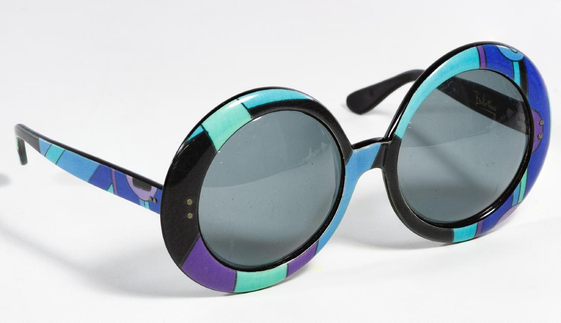 Emilio Pucci Oversized Round Sunglasses: Emilio Pucci Oversized Round Sunglasses c.1970; mod style sunglasses with designer name on the inside of one arm; made in France; with a vinyl carrying case Width: 6.50 inches, Depth: 5.50 inches Cate