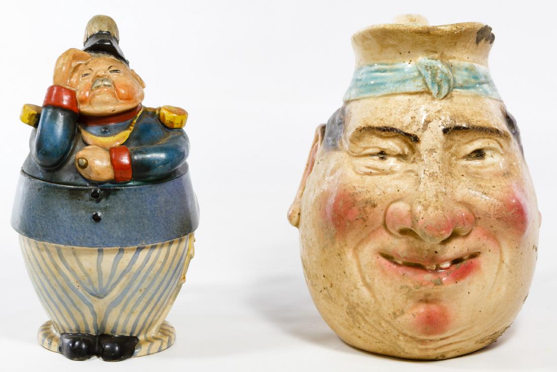 Figural Stein and Pitcher: Figural Stein and Pitcher Two ceramic items including a German figural soldier stein marked #1303 on the underside and a French Sarreguemines face pitcher #3181 Height: 8.50 inches (pitcher) Category: