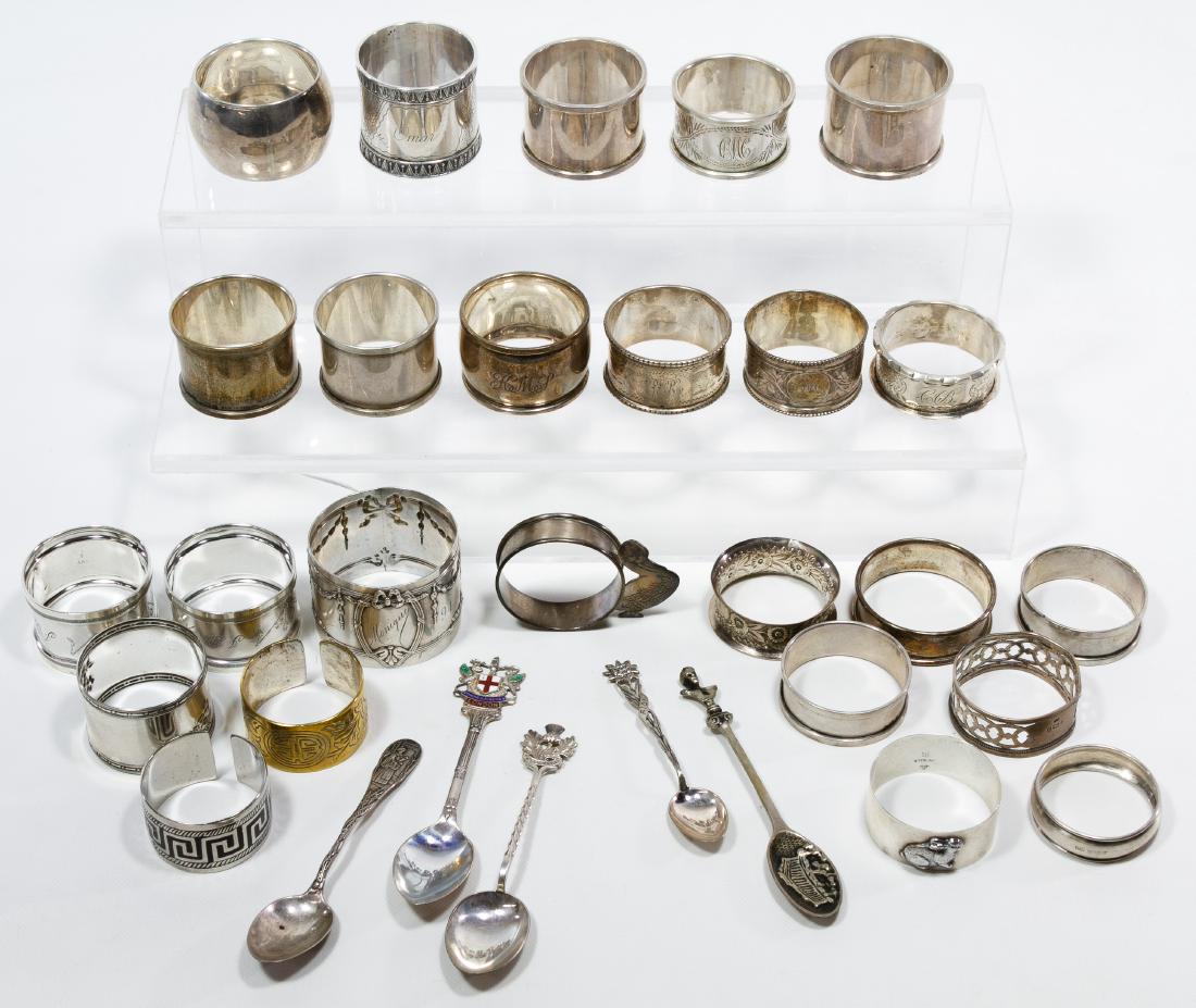 Sterling Silver Napkin Rings: Sterling Silver Napkin Rings Nineteen napkin rings; most marked 'sterling', lion passant or three towers; together with (6) silverplate or brass napkin rings, (3) sterling silver souvenir spoons and (