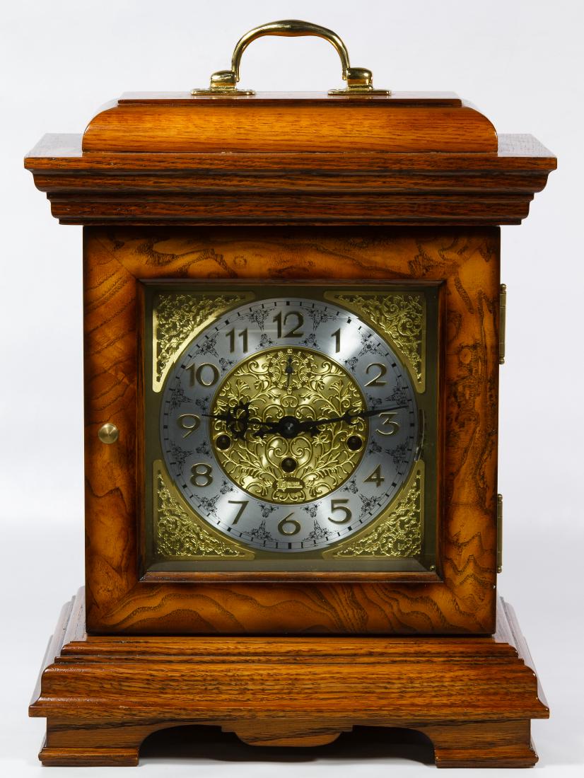 Franz Hermle Brass and Mahogany 'Atlas' Clock: Franz Hermle Brass and Mahogany 'Atlas' Clock (3) items including a Franz Hermle brass and mahogany 'Atlas clock with decorative friezes and marked '241 080' en verso of works; a Heritage Heirloom Ger