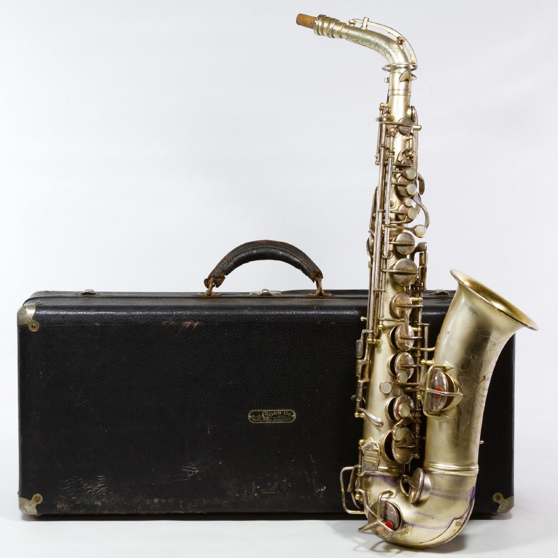 CG Conn Ltd Silverplate Saxophone with Case: CG Conn Ltd Silverplate Saxophone with Case Having the mark 'patent 1914, 111954, M191112' on base of the saxophone, neck marked #1308903; together with a velvet lined Conn marked case Height: 25.00 i