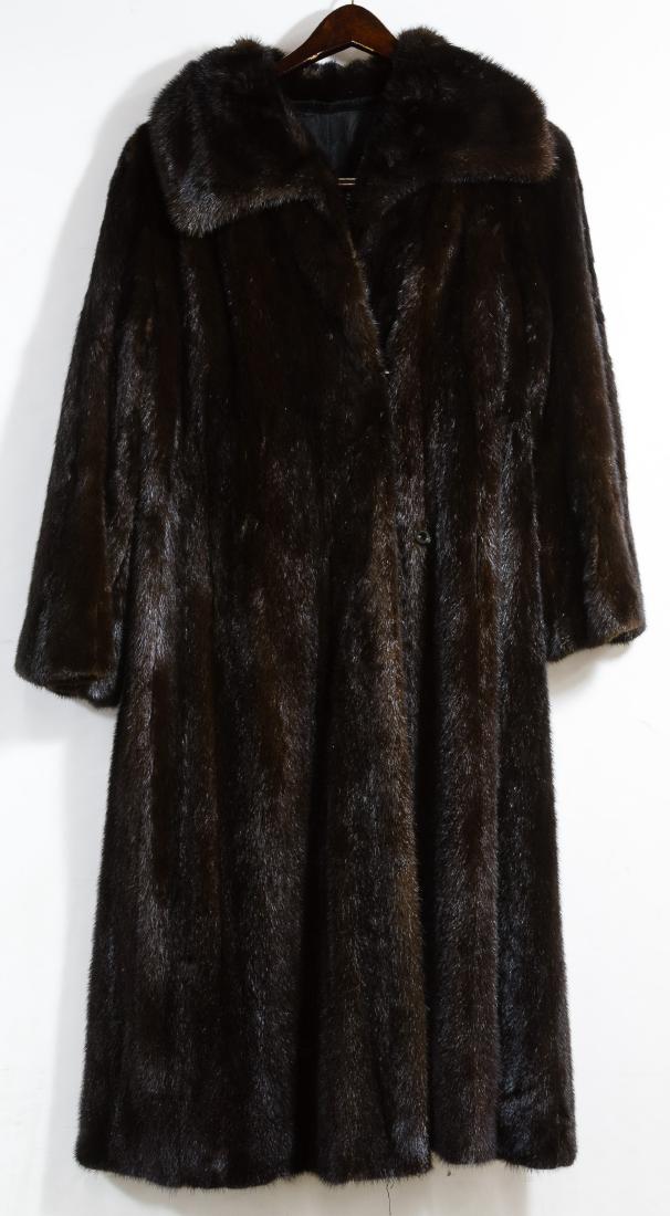 Mink Fur Full Length Coat: Mink Fur Full Length Coat Having a black lining, belt openings at the side seams, attached loops near arm pits and without a label Height: 45.00 inches, Width: 22.00 inches Category: Clothing & Access