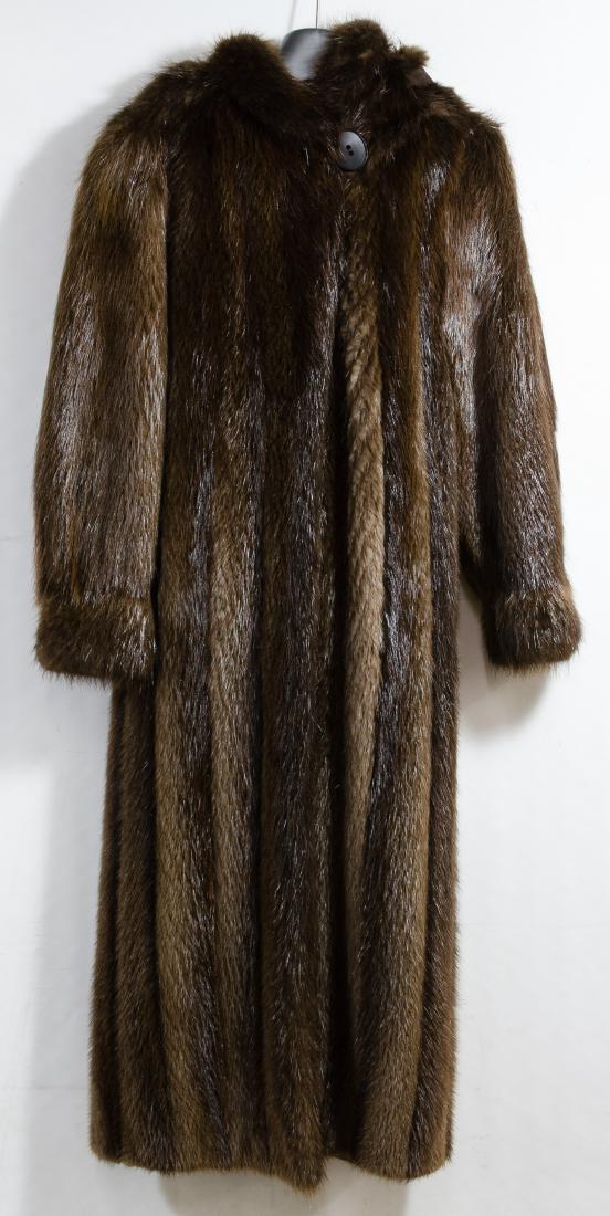 Racoon Fur Full Length Coat by Bruno & Joseph: Racoon Fur Full Length Coat by Bruno & Joseph Having a dark brown lining, a detachable hood, exterior pockets along the side seams, narrow cuffs and an interior belt Height: 51.00 inches, Width: 25.00