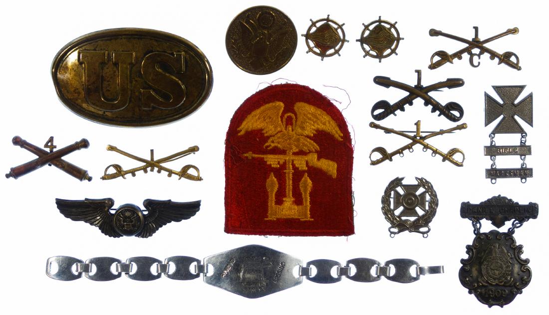 Military and Fraternal Pin, Badge and Patch Assortment: Military and Fraternal Pin, Badge and Patch Assortment Including a wing pin marked 'sterling' en verso, (5) crossed sword or cannon brass pins, a 1909 GAR medal, an eagle with rifle yellow and red pat