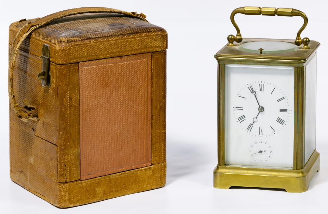 French Brass Carriage Clock by JC & Co.: French Brass Carriage Clock by JC & Co. Serial #3890, stamped maker mark on the back of the mechanism; together with a leather clock case Height: 6.75 inches (height including handle) Category: Decora