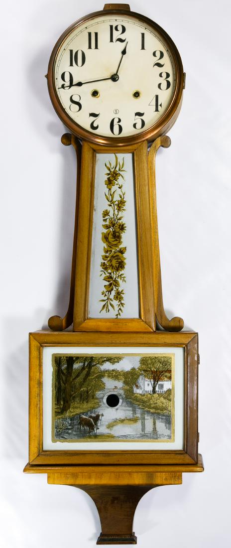 New Haven Clock Co. 8-Day Gong Banjo Clock: New Haven Clock Co. 8-Day Gong Banjo Clock Having a paper dial with copper bezel, mahogany case and painted glass windows; with pendulum Height: 36.00 inches, Width: 11.50 inches Category: Decorative 