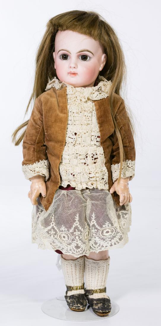 EJ Bebe Jumeau French Bisque Doll: EJ Bebe Jumeau French Bisque Doll Having a bisque head marked 'Depose E7J H', a composition body marked 'Jumeau Medaille D'Or Paris' in blue stamp mark, velvet, silk and lace dress, large brown paperw