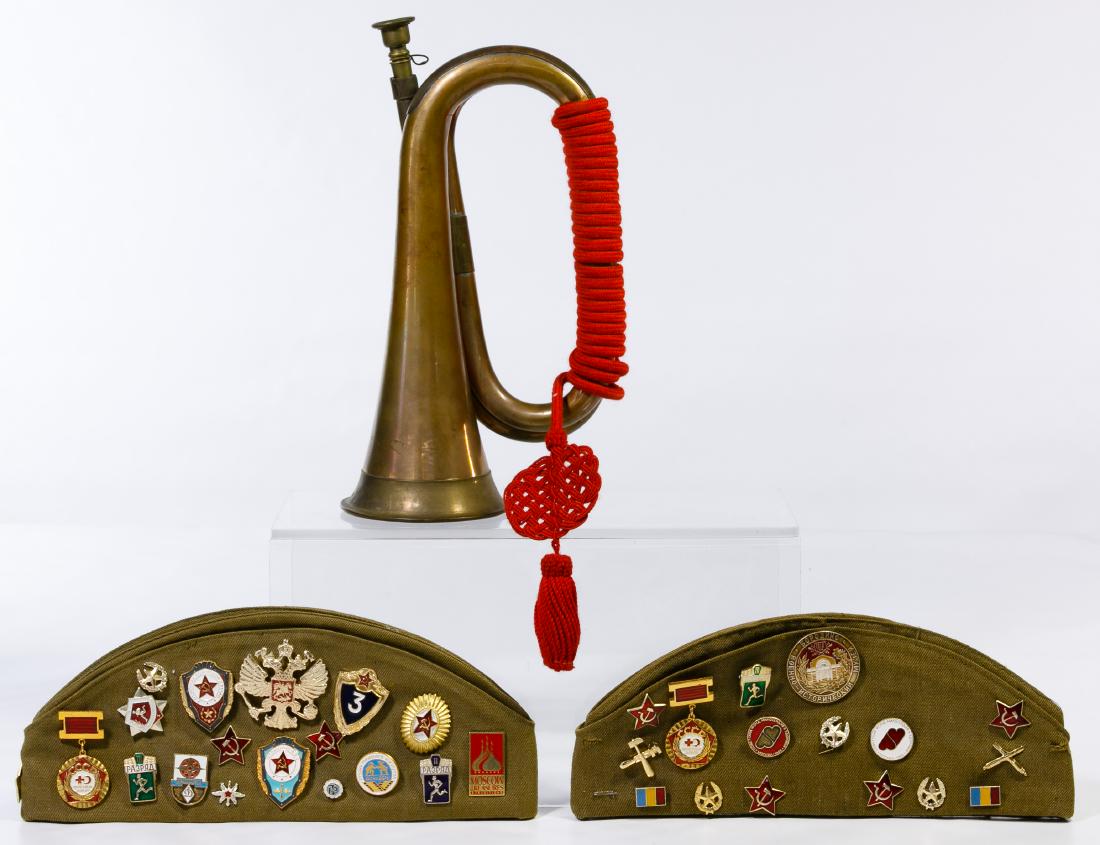 Cold War Era Russian Caps and Bugle: Cold War Era Russian Caps and Bugle Including two Soviet Union Cold War era caps with Polish and Russian patches and pins as well as an unmarked brass bugle, probably from India, having a Chinese cord