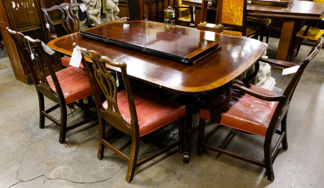 Chippendale Style Mahogany Dining Table by Baker: Chippendale Style Mahogany Dining Table by Baker Including a table and three leaves; together with two arm chairs and two side chairs, chairs having leather upholstered seats Height: 29.00 inches, Len