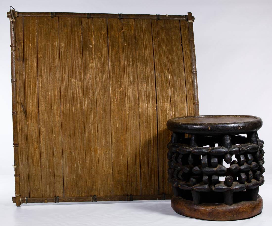 African Carved Wood Stool and Wood Splint Umbrella: African Carved Wood Stool and Wood Splint Umbrella Two items including a Babungo style wood splint umbrella and a Bikom style stool, 20th Century Cameroon Length: 31.00 inches, Width: 31.00 inches, De