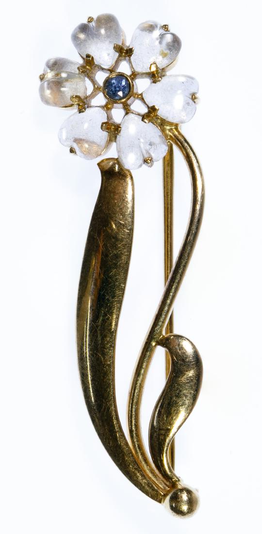 Tiffany & Co 14k Gold, Moonstone and Sapphire Brooch: Tiffany & Co 14k Gold, Moonstone and Sapphire Brooch Having six heart-shaped cut moonstones set in a flower with a small round cut sapphire in the center; marked '14k' on the back Length: 2.00 inches