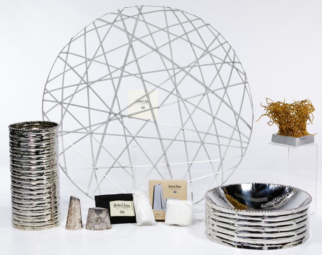 Michael Aram Tableware Assortment: Michael Aram Tableware Assortment Including a stainless steel sculpture entitled 'Criss Cross'; three aluminum items including a shallow bowl, a vase and a votive holder; two sets of silver-plated sal
