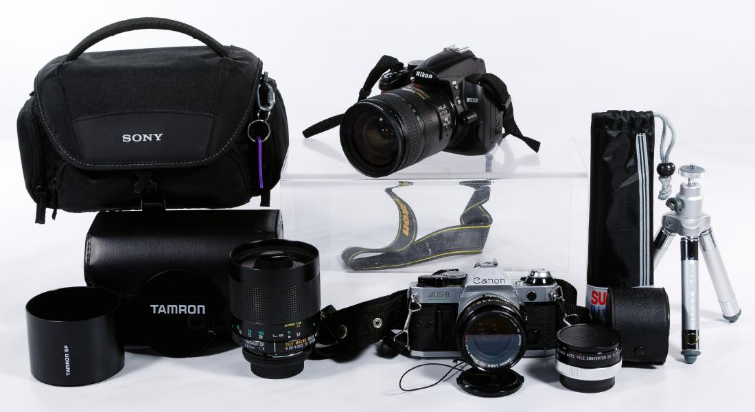 Camera and Tripod Assortment: Camera and Tripod Assortment Including Canon AE-1 camera and a Nikon D5000 camera in carrying bag, two tripods and two zoom lenses; 70-120mm Sears Macro One-Touch, 75-260mm Vivitar; Tamron 500mm lens;