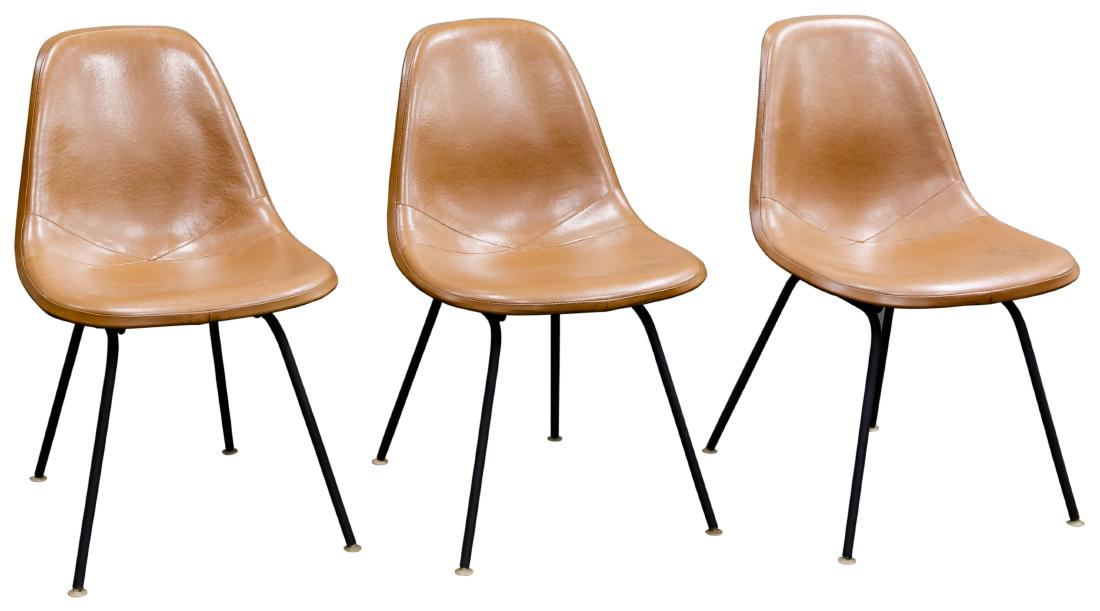 Charles Eames for Herman Miller Shell Chairs: Charles Eames for Herman Miller Shell Chairs Moulded shell chairs upholstered in caramel color leather Condition: Very Good to Good, one small stain; overall light wear consistent with age and normal