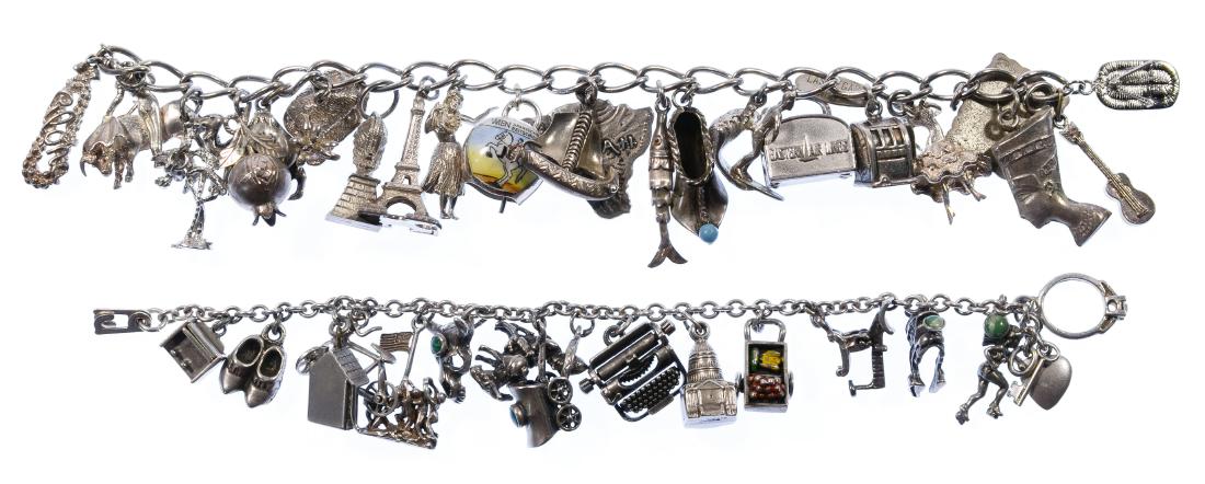 Sterling Silver Charm Bracelets: Sterling Silver Charm Bracelets Including two charm bracelets, most marked '925' or 'Sterling', one dated charm etched 1959 Condition: Good, no damage noted, showing medium wear and tarnish Length: 6.