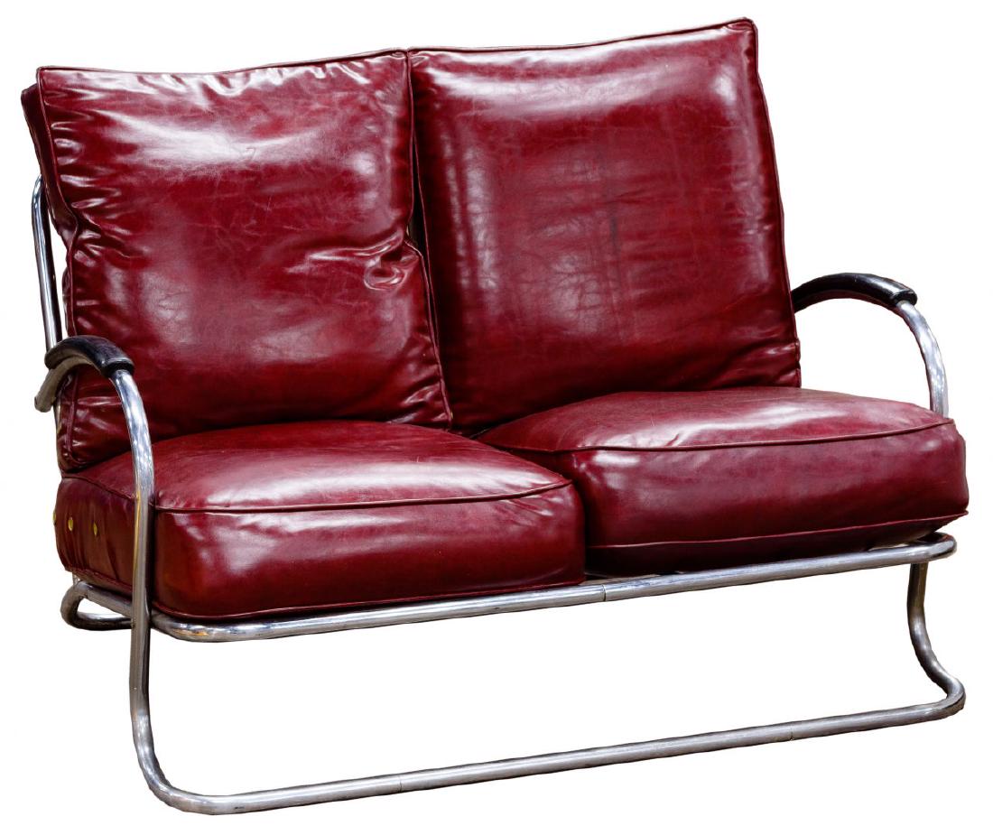 Wolfgang Hoffmann for Howell Furniture Art Deco Chrome: Wolfgang Hoffmann for Howell Furniture Art Deco Chrome and Vinyl Two-Seat Settee Tubular chrome frame having ebonized wood arm rests, two seat and two back cushions in burgundy vinyl Condition: Good,