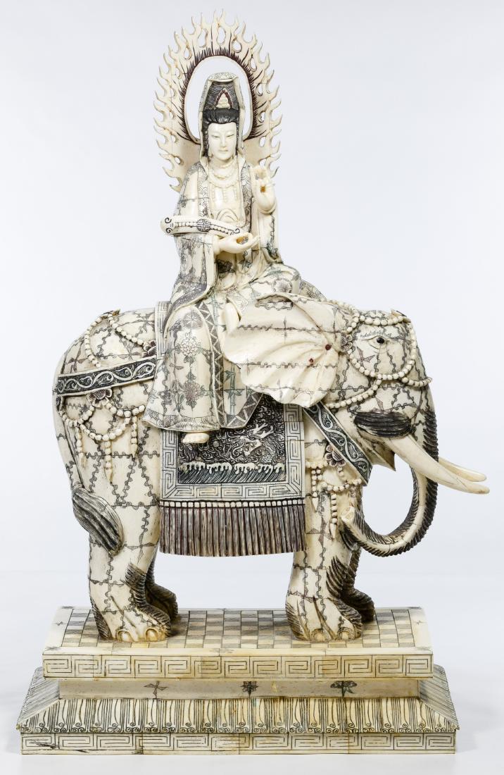 Asian Bone Veneer Sculpture: Asian Bone Veneer Sculpture 20th Century, mixed media sculpture depicting a halo Buddha holding a 'Ruyi' on an elephant; carved and glued bone veneer; stamped 'Qian Long' on underside Condition: Good,