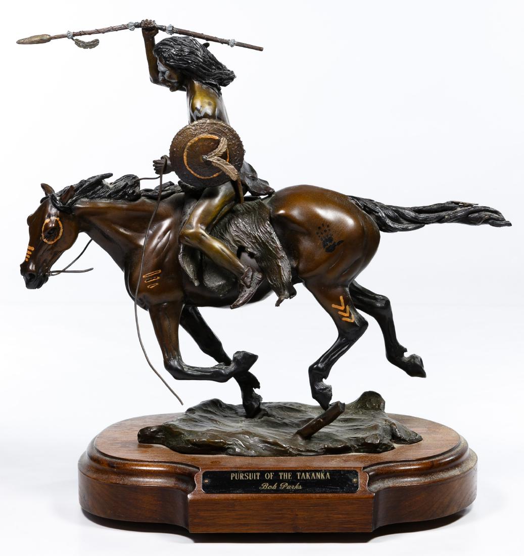 Bob Parks (American, 1943-2017) 'Pursuit of the: Bob Parks (American, 1943-2017) 'Pursuit of the Takanka' Bronze Statue Undated, bronze sculpture of an Indian figure chasing his prey on horse with spear in hand, American Indian marks on the horse; r