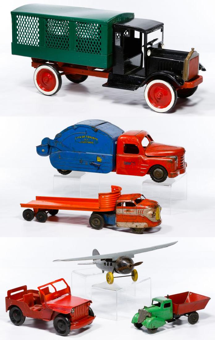 Pressed Steel Toy and Plane Assortment: Pressed Steel Toy and Plane Assortment Six items including a Keystone Packard American Railway Express truck, a Structo City of Toyland No. 7 Utility truck, a Wyandotte flatbed truck, a Wyandotte dump
