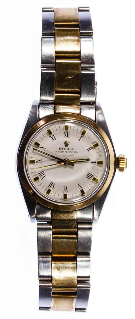 Ladies Rolex Wrist Watch Stainless Steel with '18k': Ladies Rolex Wrist Watch Stainless Steel with '18k' Gold Accent c.1975, an 'Oyster Perpetual' wrist watch having caliber 2030, reference 6748, serial 4180498, case #6751, band #451 with a 28-jewel mov