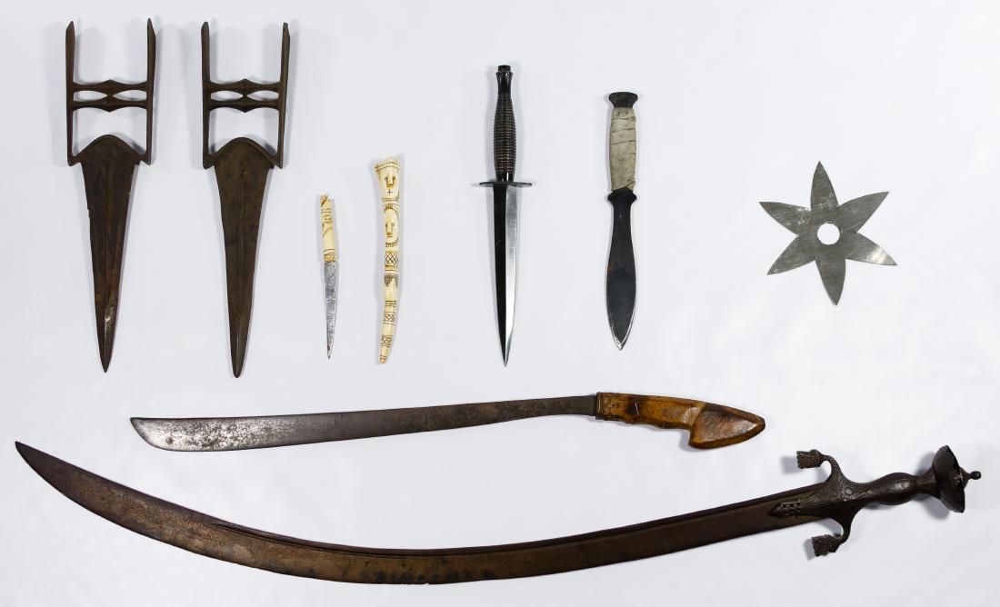 Dagger and Sword Assortment: Dagger and Sword Assortment Including an Ottoman Turk kilij sword having a decorated iron handle and pommel, a pair of Mughal or Rajput Indian iron katar punch daggers, a knife from West Timor having 