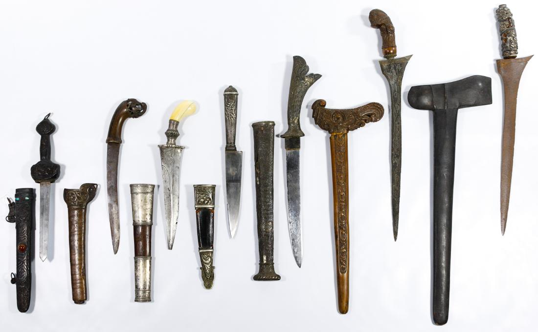 Indonesian Kris and Asian Dagger Assortment: Indonesian Kris and Asian Dagger Assortment Three Indonesian kris daggers and sheaths having carved wooden sheaths and handles; three Asian daggers having metal mounted wooden sheaths, one having semi