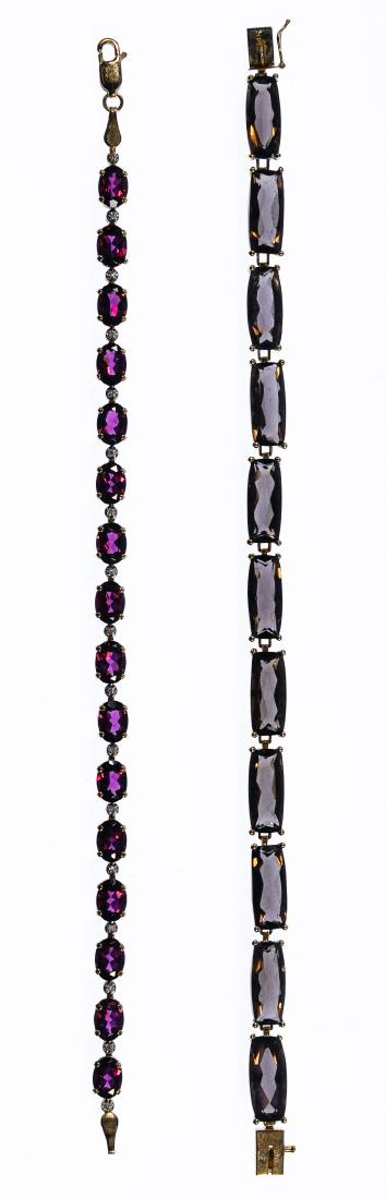 14k Gold and Semi-Precious Gemstone Bracelets: 14k Gold and Semi-Precious Gemstone Bracelets Two link bracelets having oval cut amethyst separated by very small round cut diamonds as well as elongated emerald cut smokey topaz; both marked '14k' on