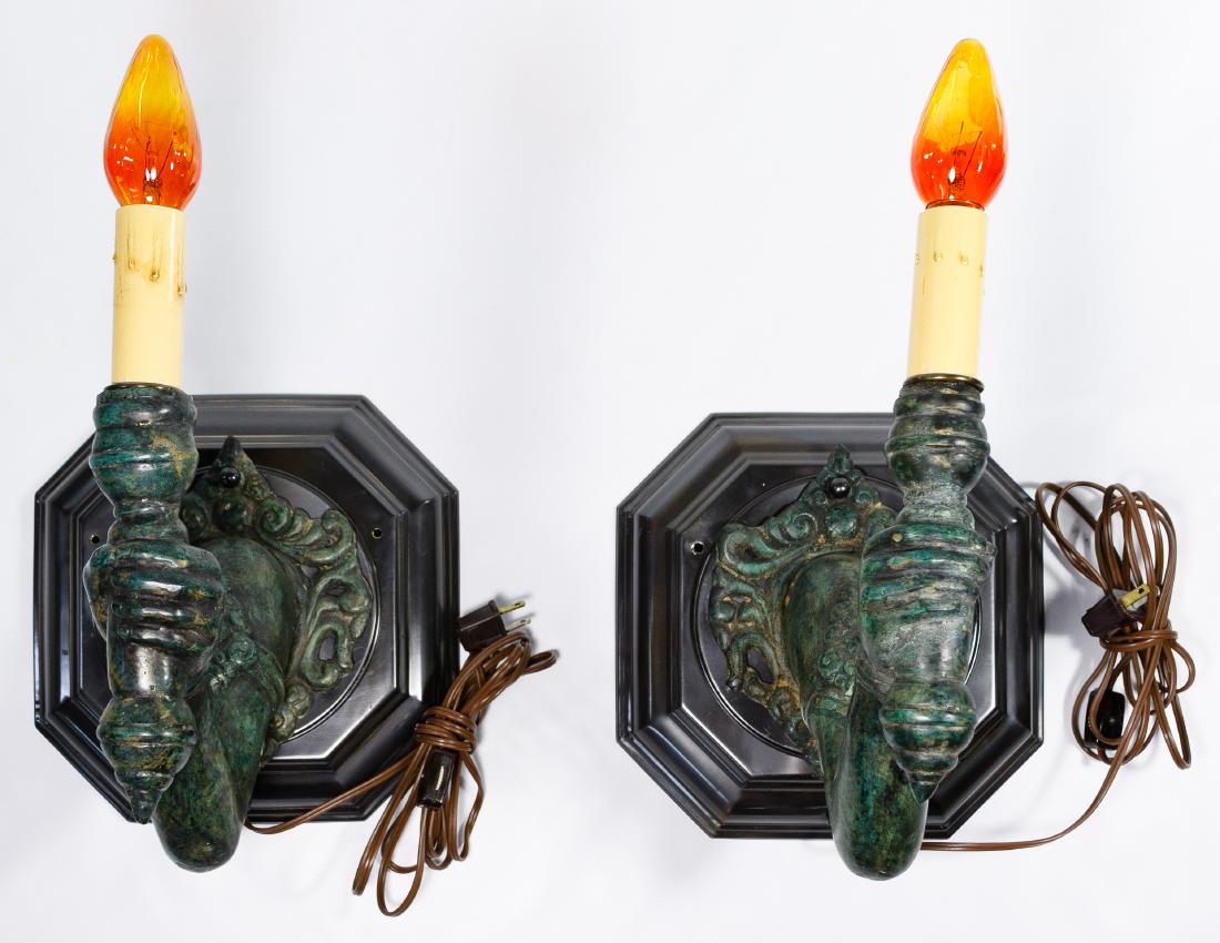 Arm with Torch Wall Sconces: Arm with Torch Wall Sconces A pair of Asian style bronze wall sconces, retrofitted to electric Condition: Good, overall light wear consistent with age and normal use, no chips or cracks noted; working