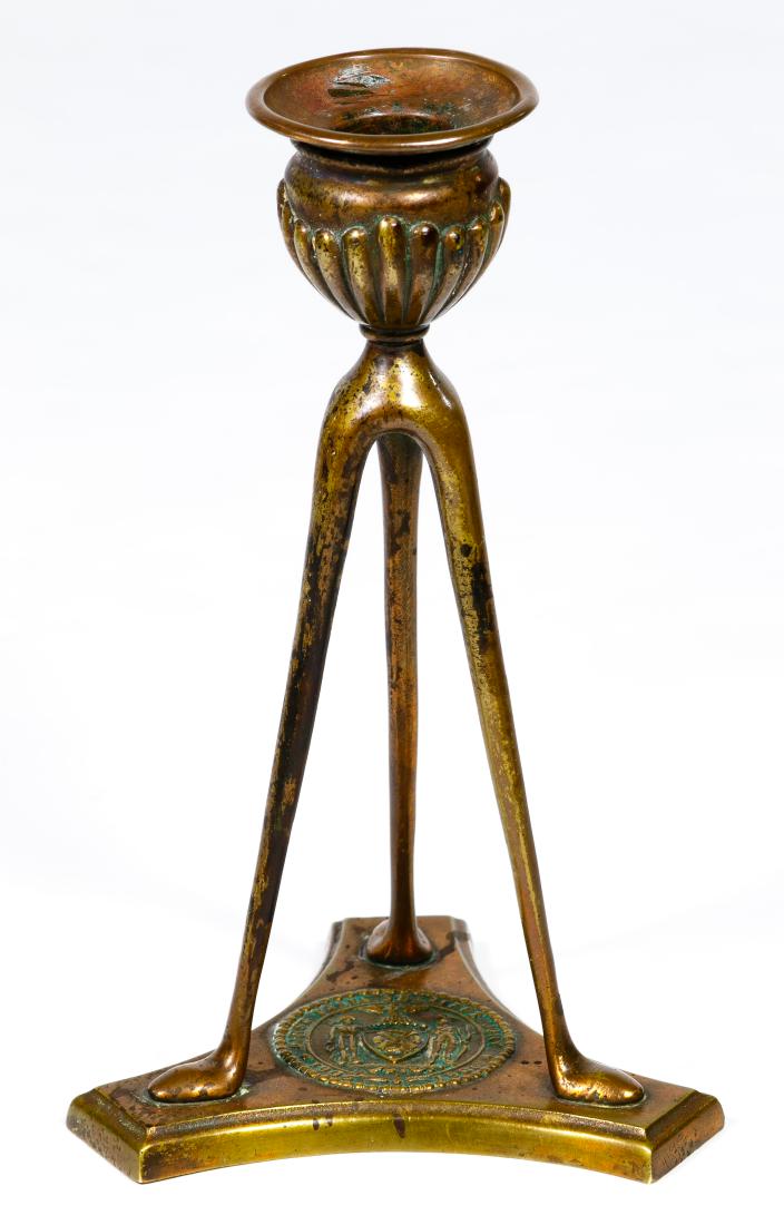 Tiffany Studios Bronze Candlestick: Tiffany Studios Bronze Candlestick c.1905, having a round emblem on the base for 'First Panel Sheriffs Jury 1905-1906', marked 'Tiffany Studios' and 'New York' on the underside Condition: Very Good, l