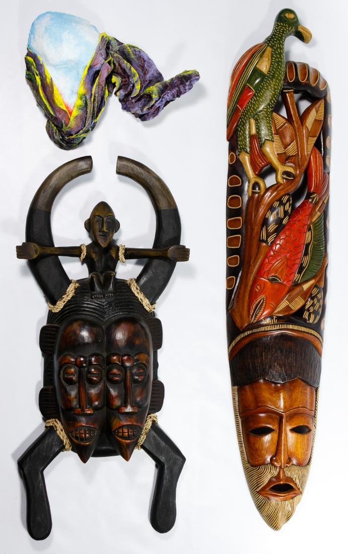Ethnographic Mask Assortment: Ethnographic Mask Assortment Three masks including a Senufo style double-faced mask from West Africa, a colorful example from Haiti decorated with carved animals and a contemporary painted modeled fab
