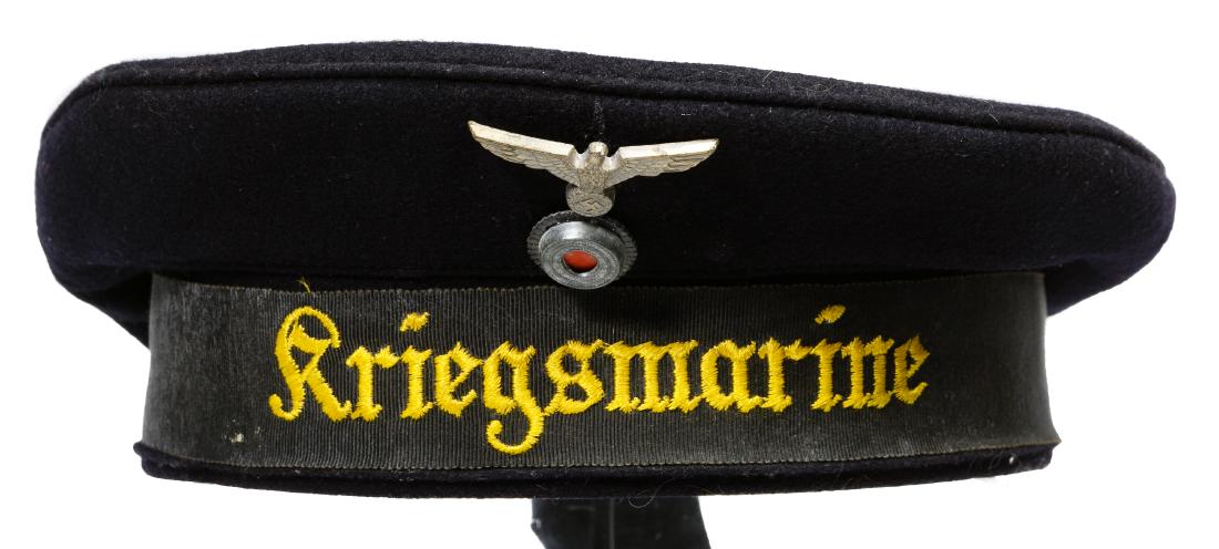 World War II Era German 'Kriegsmarine' German Sailor: World War II Era German 'Kriegsmarine' German Sailor Cap and Medals Having an attached metal Nazi emblem; together with three German Nazi medals depicting an eagle, skull and Congo iron cross medal Co