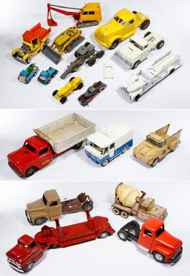 Buddy 'L', Hubley and Structo Toy Truck Assortment: Buddy 'L', Hubley and Structo Toy Truck Assortment Seventeen metal trucks including a cement truck, dump truck, crane, earth mover and mail truck Condition: Good to Fair, overall heavy wear; having sc