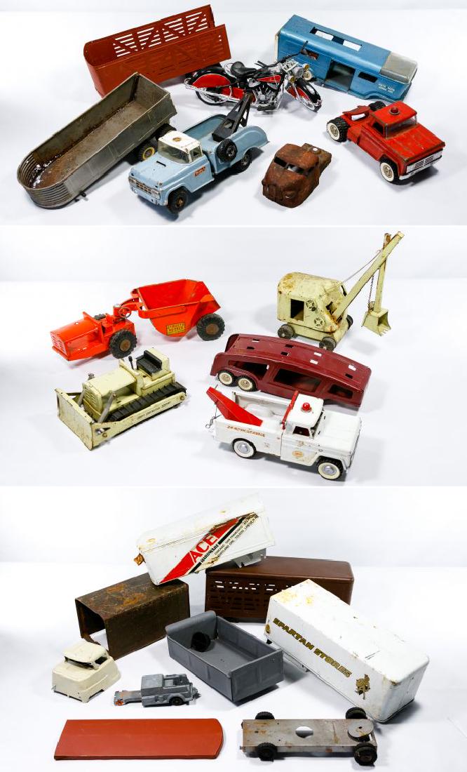 Structo Toy Trucks Assortment: Structo Toy Trucks Assortment Including a steam shovel, bulldozer, rocker, tow truck, car carrier trailer, dump trailer, Vista Dome horse van and other partial vehicles; together with a plastic model 