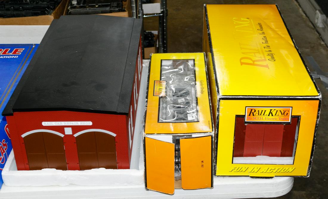 Model Train Accessory, Tender and Track Assortment: Model Train Accessory, Tender and Track Assortment Including buildings, bridges and track with examples from Rail King; together with a Lionel train car box Condition: Very Good to Fair, Lionel box em