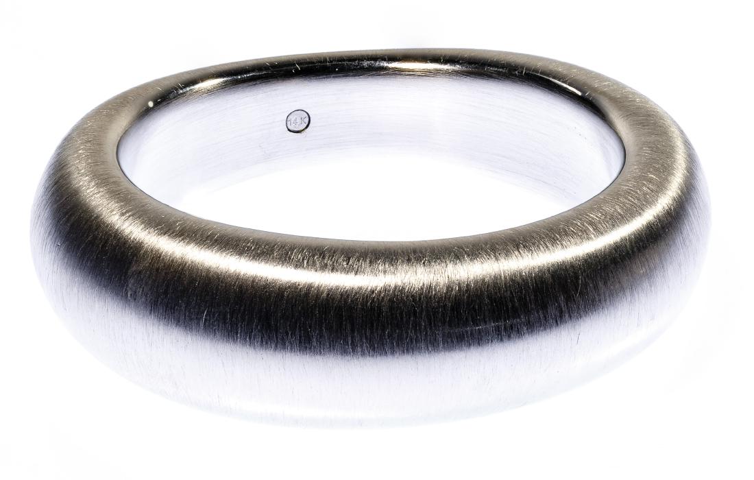 Milor 14k White Gold Bangle Bracelet: Milor 14k White Gold Bangle Bracelet Having a brushed finish; marked '14k', 'Milor' and 'Italy' inside the bangle; bracelet resin filled to prevent denting Condition: Very Good, light wear Length: 7.7