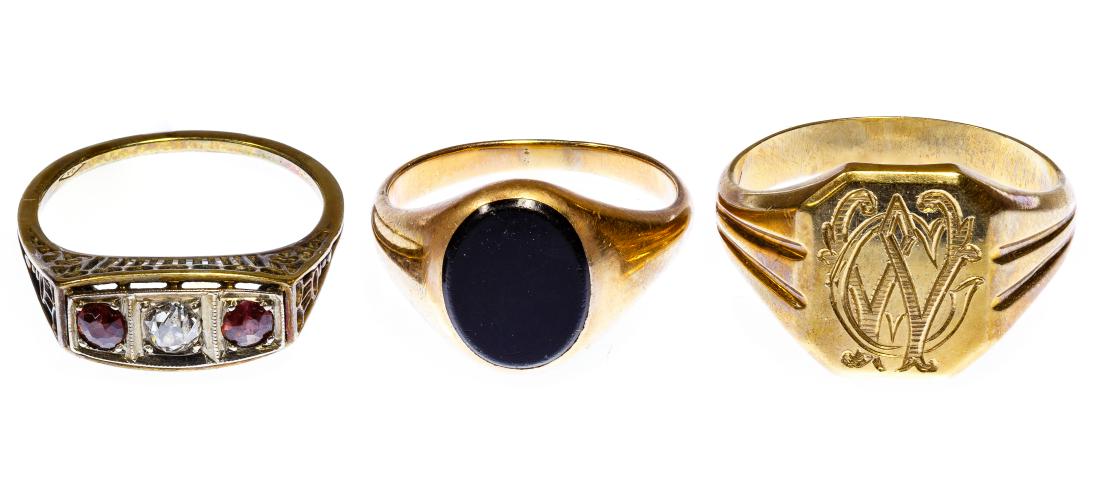 14k Gold Ring Assortment: 14k Gold Ring Assortment Three rings including a signet ring, an oval flat cut onyx ring and a round cut diamond with two garnets ring Condition: Very Good to Good, overall light to moderate wear, two