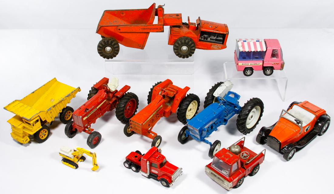 Pressed Steel Toy Truck Assortment: Pressed Steel Toy Truck Assortment Various scale toy trucks and tractors, seventeen items including makers Buddy 'L', ERTL, Tootsietoy, Nylint, Corgi, Structo Condition: Good to Fair, most items havin