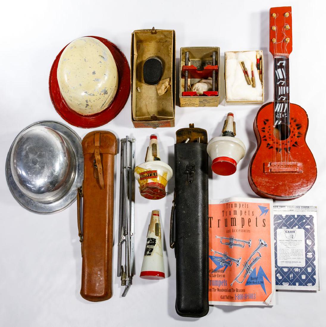 Musical Instrument Accessory Assortment: Musical Instrument Accessory Assortment Including music stands, horn mutes, reeds, mouthpiece pullers, tin hats, some in original boxes; together with a wood figurine and a 'Hopalong Cassidy' cap gun