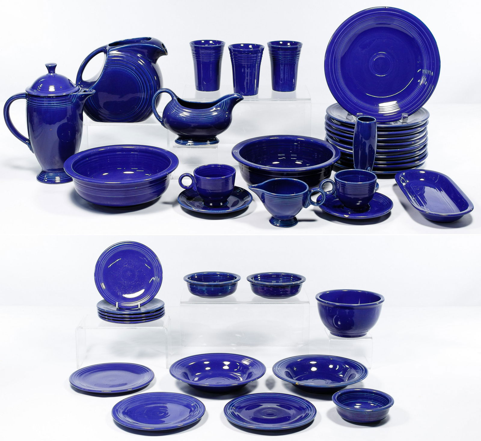 Homer Laughlin Fiestaware "Cobalt Blue" Collection: Homer Laughlin Fiestaware 'Cobalt Blue' Collection c.1936-1951; (39) pieces including (9) 9.5-inch plates, 10.5-inch plate, (2) 9.5-inch serving bowls, gravy boat, 11.5-inch coffee pot with lid, 7.5-i