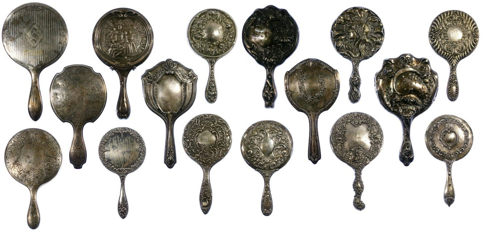 Sterling Silver Vanity Mirror Assortment: Sterling Silver Vanity Mirror Assortment Sixteen vanity mirrors marked 'sterling'; most having Victorian style floral decoration; one having a cast relief garden scene, with figures, signed 'Watteau' 